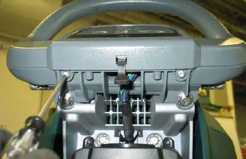 Removing a torx screw from the back of the operator console