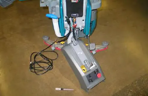 Access cover lowered to the floor, hanging from its cable