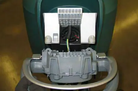 Operator console lifted forward off the machine