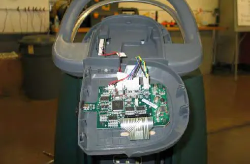Console panel lifted away to show the interface module circuit board