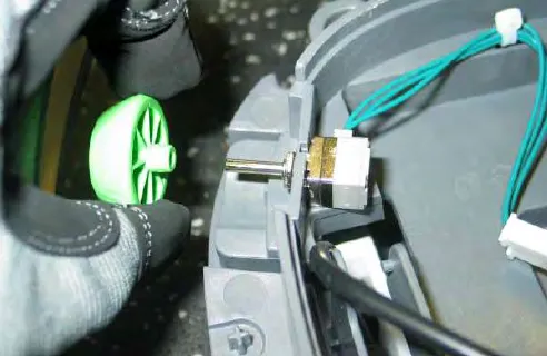 Removing a plastic knob and the nut that secures the potentiometer