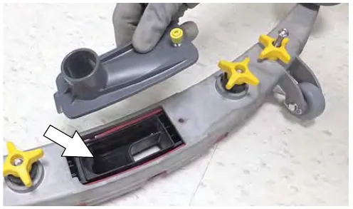 Removing the drip tray cover from the squeegee assembly to show the reservoir