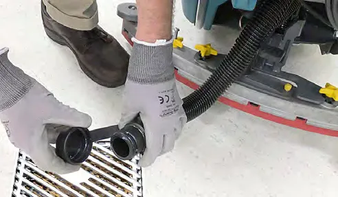 Draining the solution and recovery tanks over a floor drain