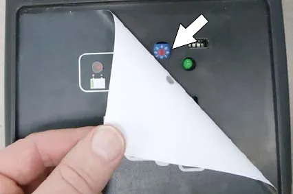 Charger display label peeled back to show the dial