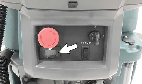 Arrow pointing at the hour meter on the control housing
