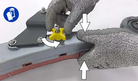 Loosening the knob on the squeegee assembly while squeezing the retainer and frame together; protective gloves symbol