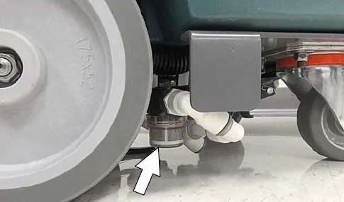 Solution tank filter under the machine marked by an arrow
