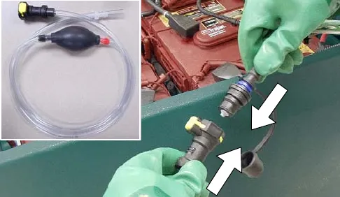 Hand pump hose and bulb, and the hose being connected to the battery fill hose coupler