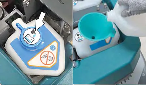 Refilling the automatic battery watering tank through a funnel with distilled water
