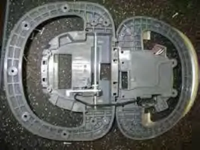 Underside of the operator console showing the rear self tap screws