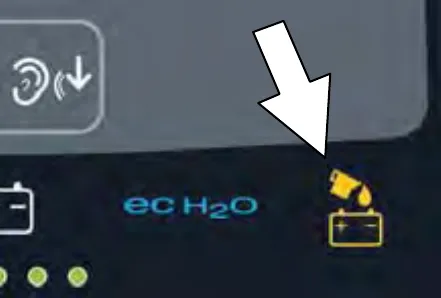 Control panel with an arrow pointing to the automatic battery watering indicator