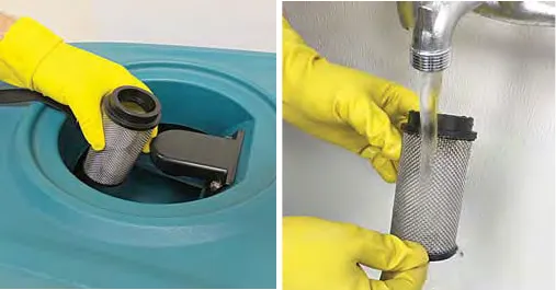 Lifting the float shut-off screen out of the recovery tank and rinsing it under a tap