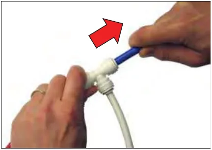 Hand pulling on the fitting, with a red arrow