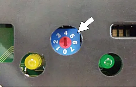 Close-up of the charger dial with an arrow pointing to it
