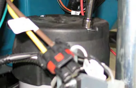 Orbital head motor with its cap removed and the wire connector visible