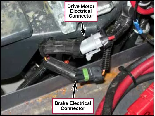 Photo of the upper drive motor electrical connector and the brake electrical connector, two black plugs joined together