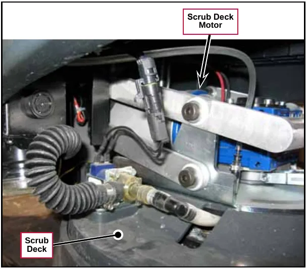 Photo of the top of the 20D scrub deck with the Scrub Deck Motor and Scrub Deck labeled