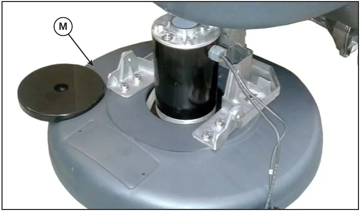 Photo of the REV deck with the motor mounted on it; a callout labeled M points to the deck body (the step text calls the deck L)