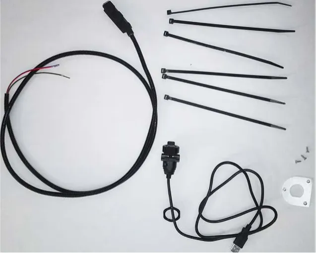 USB kit parts laid out: wiring harness, USB cable, cable ties, mounting plate and screws
