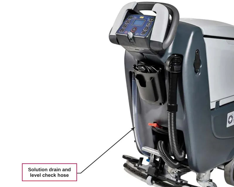 Photo of the rear of the machine with a label pointing to the solution drain and level check hose