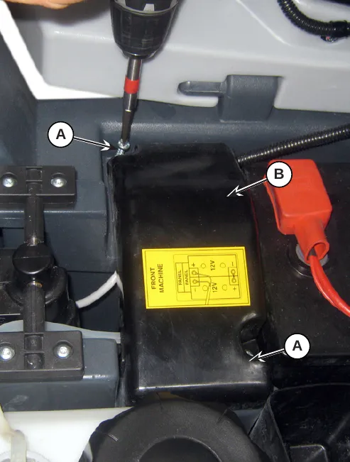 Photo of the cover B over the battery compartment with screws A