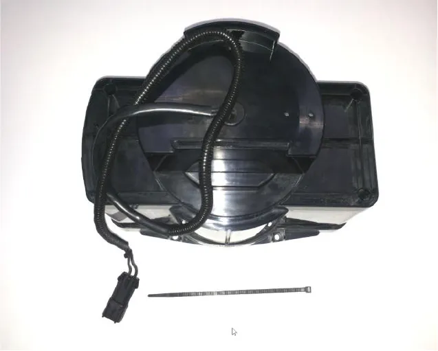 Vacuum motor group in its housing with wiring harness, and a cable tie