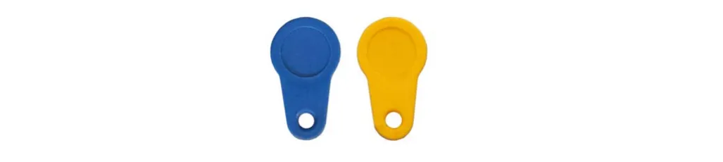 The two magnetic smart keys: a blue key and a yellow key (the yellow one is the supervisor key)