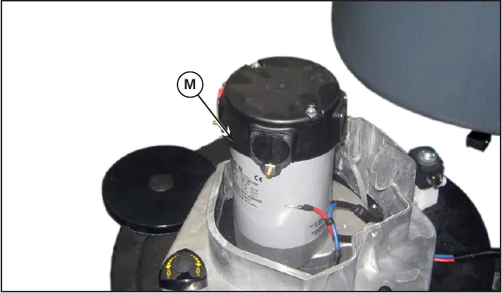 Photo of the brush deck M with the brush motor, being extracted from beneath the solution tank.