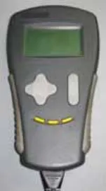 Photo of the Curtis 1311-1101 hand-held programmer with a green display, directional pad and three yellow buttons