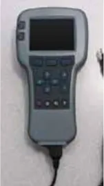 Photo of the Curtis 1313-1101 hand-held programmer with a dark display, keypad and cable