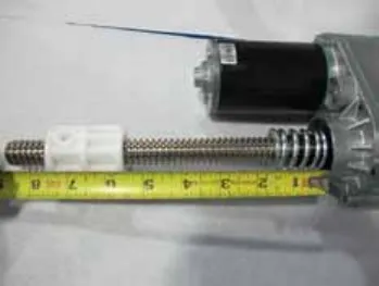 Photo of a tape measure along the lead screw from the drive nut to the motor housing, extended position, 5 1/2 inches.