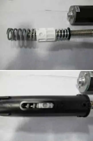 Two photos: the lower spring, drive nut and lead screw laid out before the spring is installed, and the spring housing with its slotted holes aligned over the drive nut