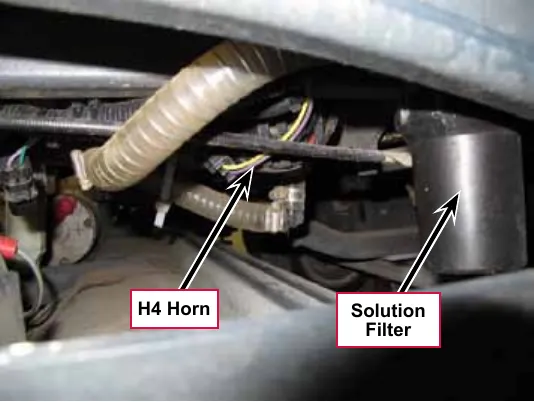Photo under the machine showing the H4 horn and the solution filter