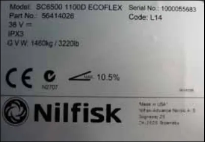 Photo of a machine nameplate: Model SC6500 1100D ECOFLEX, Part No. 56414026, Serial No. 1000055683, Code L14, 36 V DC, IPX3, G.V.W. 3220 lb (1460 kg), maximum gradient 10.5%, CE mark, Nilfisk logo