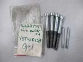 Photo of the tire puller kit: a bag labeled 56422174 tire puller kit with long threaded screws and shorter pilot studs