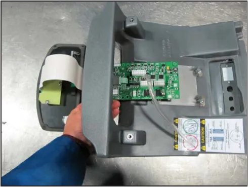 Interface panel and controller circuit board lifted together out of the cover opening