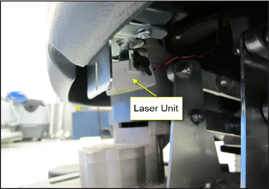 Laser unit mounted under the machine body on a bracket, with an arrow from the label “Laser Unit”