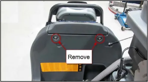 Rear of the machine with the two upper cover mounting screws circled and marked Remove