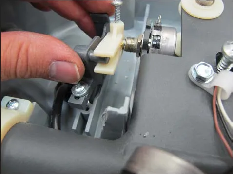 Photo of a hand loosely installing the potentiometer fork onto the potentiometer shaft