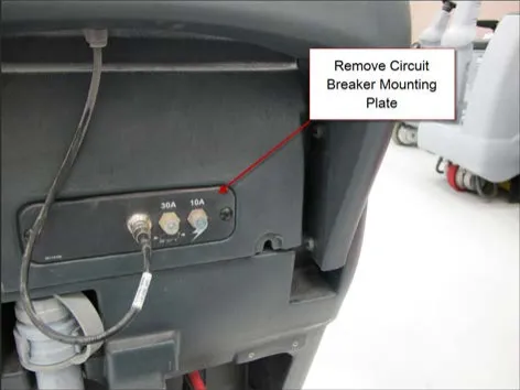 Back of the handle area with the circuit breaker mounting plate showing a 30A and a 10A breaker and a callout reading Remove Circuit Breaker Mounting Plate