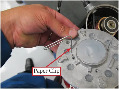 Photo of a paper clip inserted through the access hole in the end cover, labeled Paper Clip.