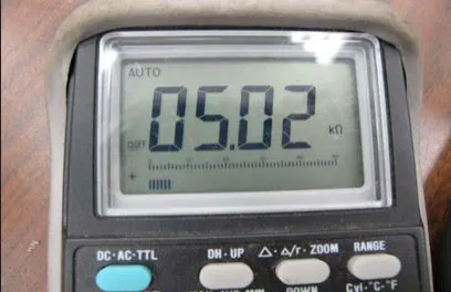 Photo of a meter display reading 05.02 kilohms