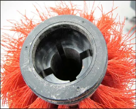 End of the brush showing the internal slots that engage the drive hub flanges