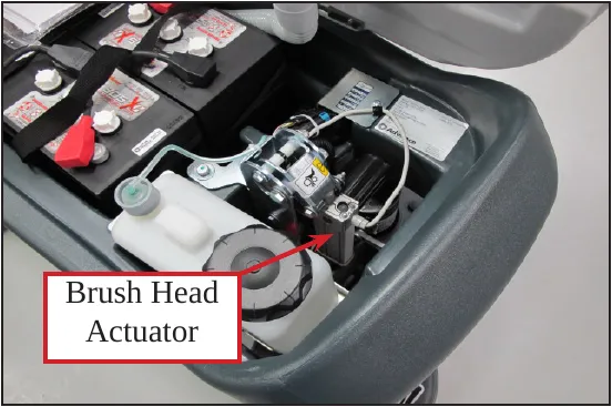Photo of the battery area with an arrow to the brush head actuator, labeled Brush Head Actuator.