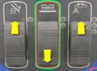 Three rocker switches (vacuum, scrub, solution) from left to right with yellow arrows: vacuum up, scrub down, solution up