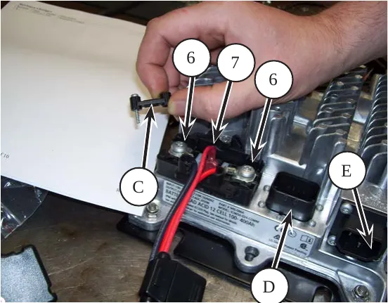 Delta-Q charger with callouts: C clamp, 6 battery positive and negative wires, 7 interlock wire, E AC power cable, D battery temperature sensor connector