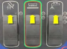 Three rocker switches (vacuum, scrub, solution) from left to right with yellow arrows: all three pointing up (forward)