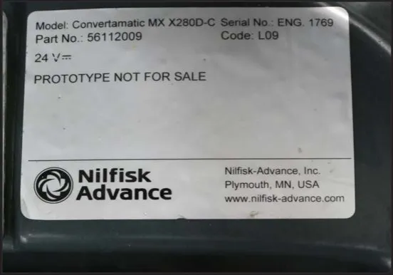Close-up of a nameplate showing Model, Part No., 24 V, Serial No. and Code fields and the Nilfisk-Advance logo