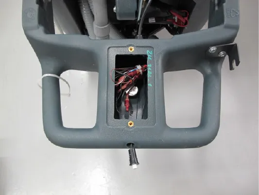 Photo of the ST handle turned down with the access plate removed, showing the wiring and reverse switch inside the opening