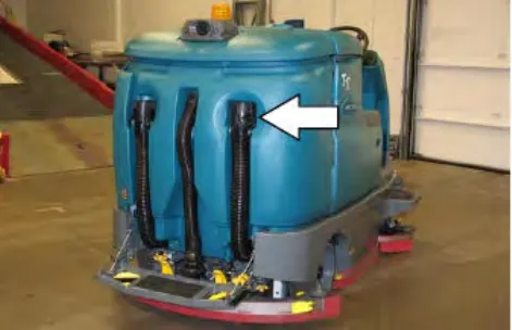 Rear of the machine with an arrow pointing at the recovery tank drain hose